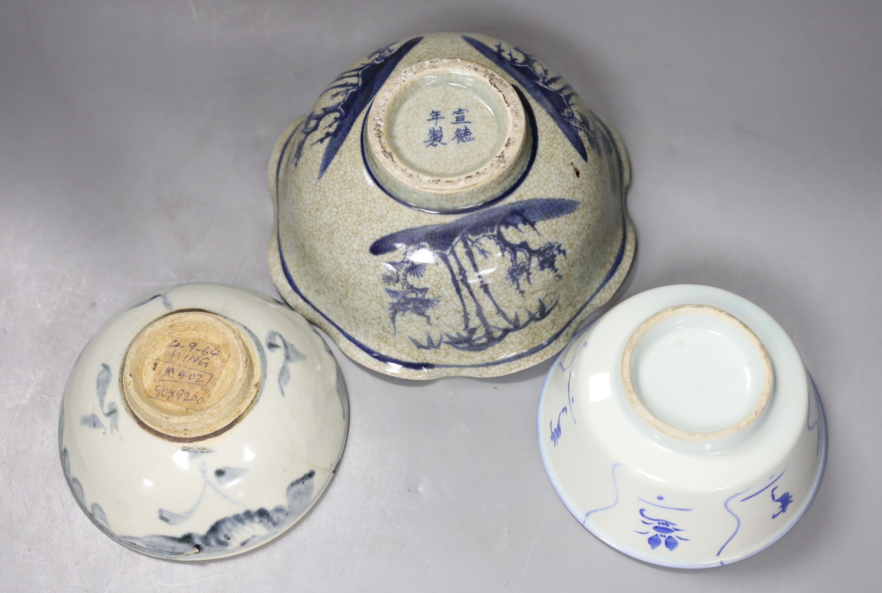 Three Chinese porcelain blue and white bowls, largest 17cm. diam.